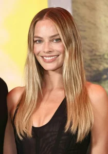 Margot Robbie Stuns in Bold Black Mini Dress for First Red Carpet Since Baby Reveal