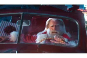 John Travolta Shines as Santa in Viral Capital One Ad